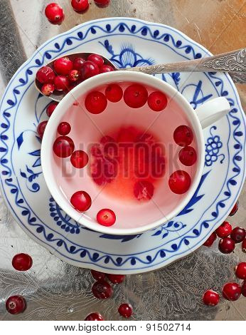 Cranberry Tea And Berries In Saucer On A Tray
