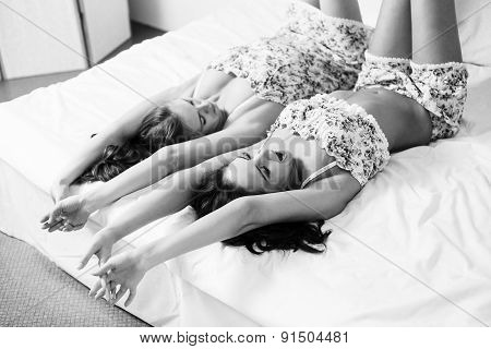Ttwo beautiful women in the bed