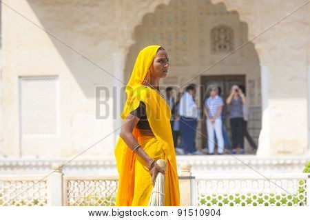 Woman Of Fourt Class In Brightly Colored Clothing Cleans The Amber Palace