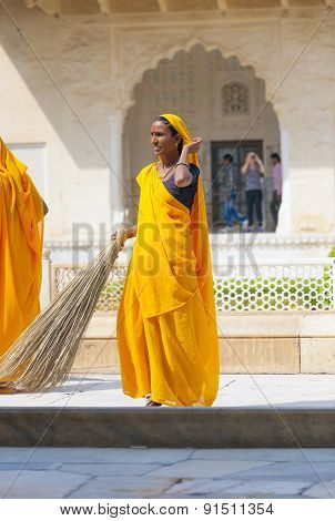 Woman Of Fourt Class In Brightly Colored Clothing Cleans The Amber Palace