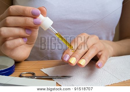 Women's Hands Is Applied Oil For Cuticles