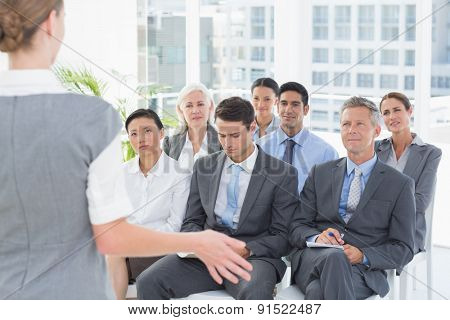 Business people listening during meting in office