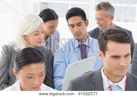 Business people listening during meting in office