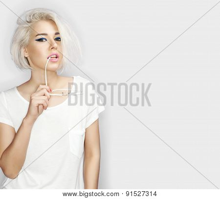 Fashion blond model girl with sunglasses