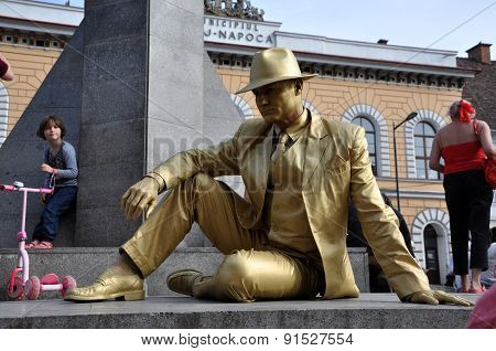 Street Performer, Living Statue In Golden Costume
