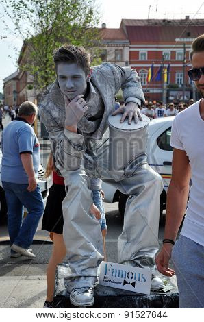 Street Performer, Living Statue In Silver Costume