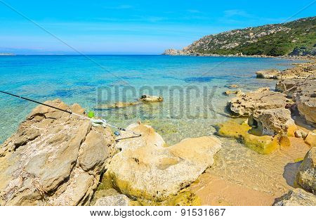 Fishing Rod On The Rocks In Capo Testa