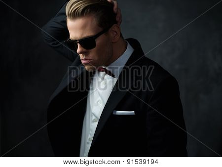 Tough sharp dressed man in black suit 