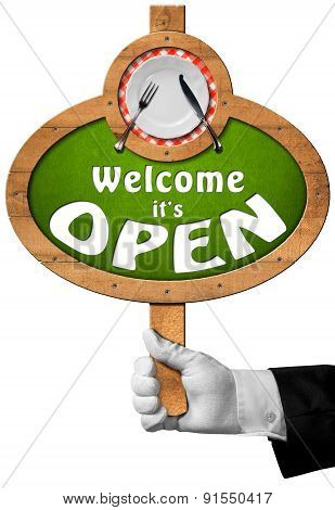 Welcome It Is Open - Sign With Hand Of Waiter
