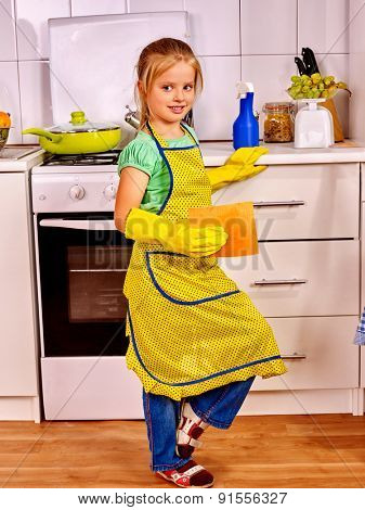 Child little girl  cleaning  home kitchen. Housekeeping.