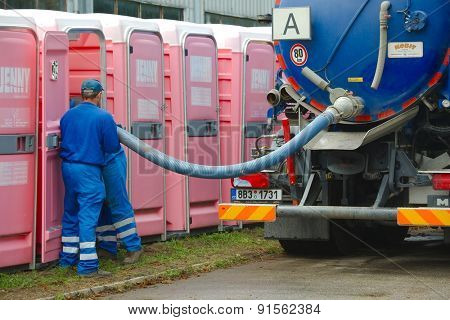 HODONIN, CZECH REPUBLIC - AUGUST 17: Cleaning of the mobile toilets at Made of Metal, August 17th 2014.