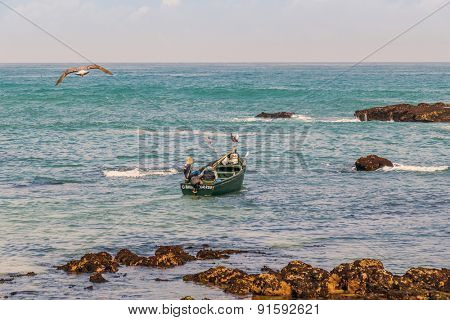 OUALIDIA, MOROCCO, APRIL 6, 2015: Fishermen go to sea in fishing boat