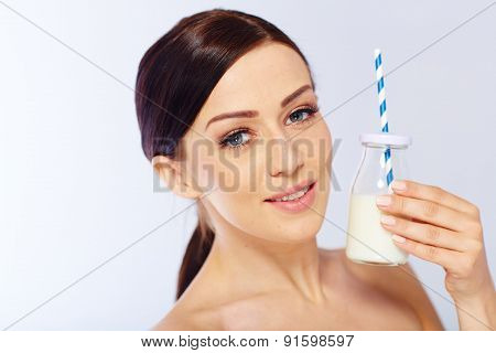 young woman with a glass of milk