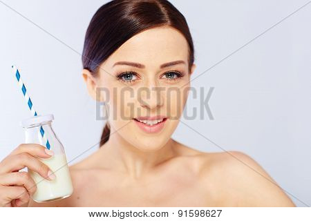 young woman with a glass of milk