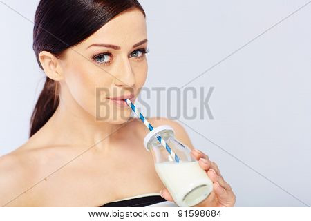 young woman with a glass of milk