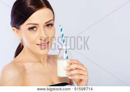 young woman with a glass of milk
