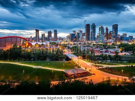 City scape at dusk with lights of the city glowing
