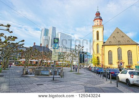 FRANKFURT GERMANY - APRIL 29 2012: St Catherine Church in Frankfurt in Germany. It is also called Katharinenkirche. It is placed in the Hauptwache. Tourists nearby