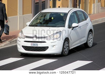 Monte-Carlo Monaco - April 6 2016: White Citroen C3 on Avenue d'Ostende in Monaco. Man Driving a French Car Citroen C3 in the South of France