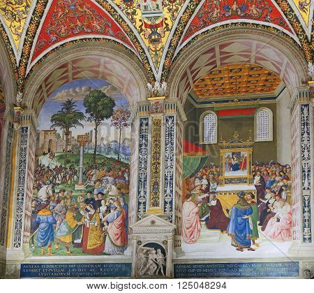 SIENA, ITALY - MARCH 12, 2014: Pinturicchio's frescoes in the Piccolomini Library of Siena Cathedral