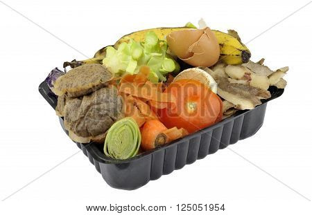Vegetable fruit household kitchen food waste collected in re-used packaging for home composting.