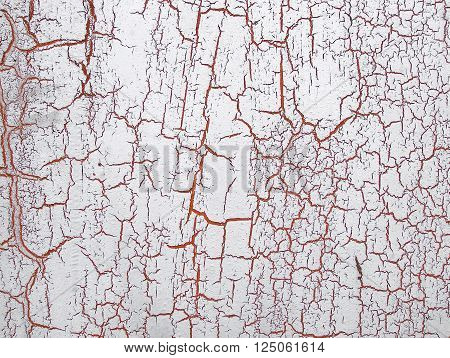 Old cracked paint on the wall. Grunge rusty texture. Grunge metal background. Retro texture. Vintage texture. Peeling paint. Distress Texture. Scratched wall pattern