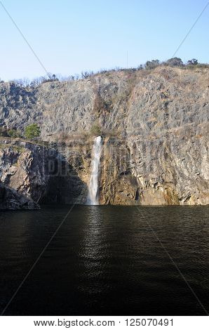 A waterfall within the rock quarry within Chenshan Botanical Gardens in Shanghai China.