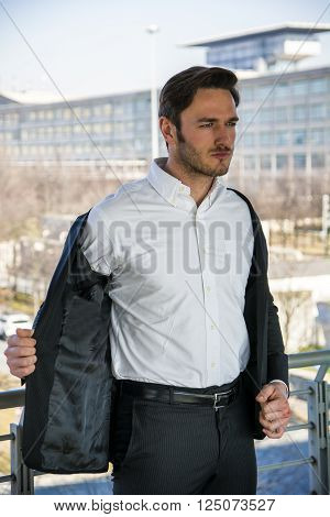Head and Shoulders Portrait of Stylist Young Man Wearing Suit and Hat Looking to the Side Out Window While Standing on Moving Sidewalk in Building
** Note: Soft Focus at 100%, best at smaller sizes