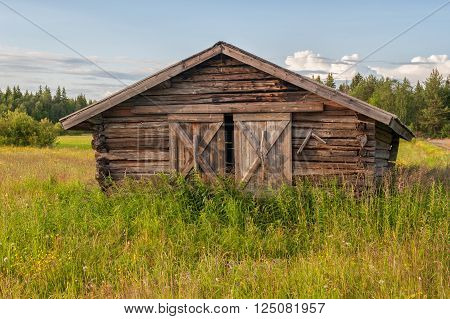 Traditional hay barn near Kalix typical for county Norrbotten in northern Sweden