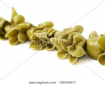 Line of sacchettoni stuffed sacchetti pasta isolated over the white background