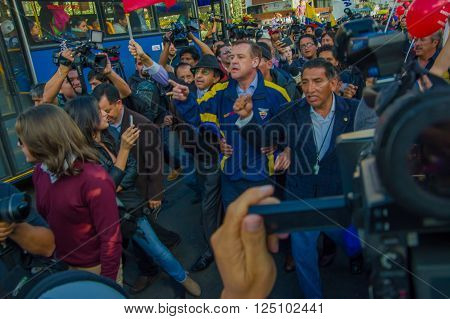 Quito, Ecuador - April 7, 2016: Closeup opposition leader Andres Paez surrounded by people, police and journalists during anti government protests in Shyris Avenue.