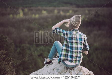 Young woman watching landscape, posing outdoor. Active lifestyle concept. 