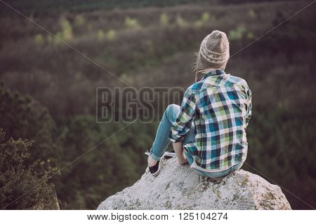 Young woman watching landscape, posing outdoor. Active lifestyle concept. 
