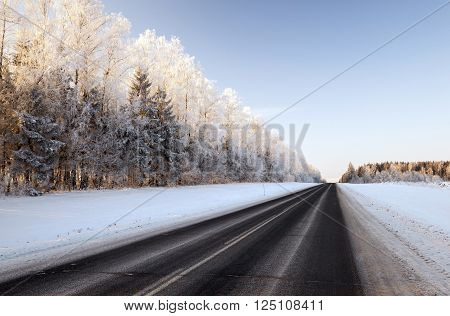 Photographed Road In The Winter. Winter, The Road Is Covered With Snow