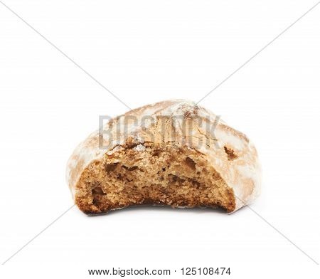 Single russian gingerbread cookie, bitten, composition isolated over the white background