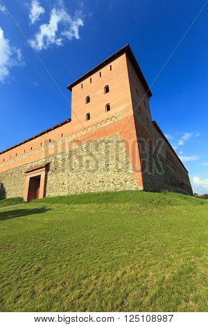 Old Fortress Orange Color, Located In The City Of Lida, Belarus