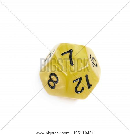 Yellow roleplaying polyhedral dodecahedron gaming plastic dice isolated over the white background