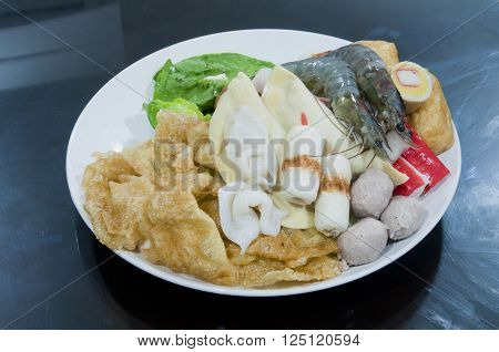 Mix fresh raw vege with seafood prepared for seafood
