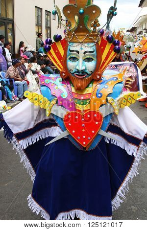 Cajamarca Peru - February 7 2016: Costumed figure wearing King of Hearts costume and marching in Cajamarca Peru Carnival parade on February 7 2016.
