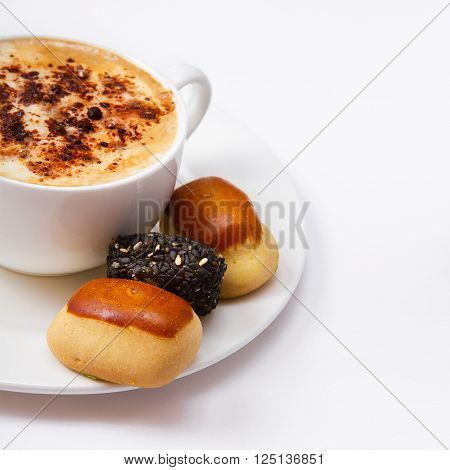 Cup of coffee and sweets close up top view square isolated. Coffee concept. Selective focus