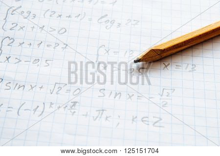 Squared sheet of paper filled with trigonometry math equations and formulas