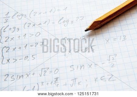 Squared sheet of paper filled with trigonometry math equations and formulas