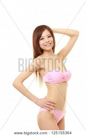Japanese woman posing in a pink bikini