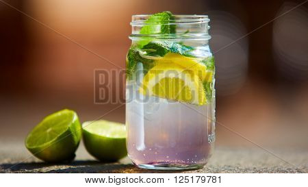 Iced drink with mint and citrus fruit. Shallow dof