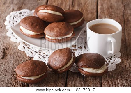 American Whoopie Pie Pastry And Coffee With Milk Close-up. Horizontal