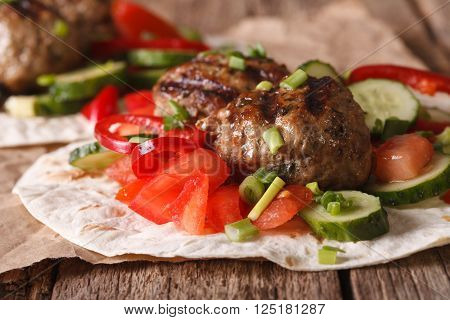 Turkish Kofta With Fresh Vegetables On A Flat Bread Close Up. Horizontal