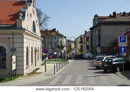 Wieliczka, Poland - April 04, 2016: Tadeusz Ko?ciuszko Square. Townhouses, some people are walking. On the left 
