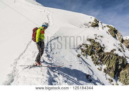 Zakopane, Poland - March 28 2016: Ski mountaineering on the edge of the couloir is preparing to exit.