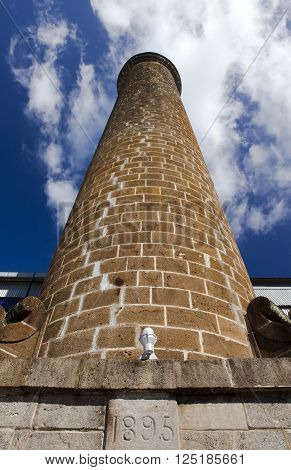 Ancient brick pipe (1895) in the old sugar cane factory. Mauritius.