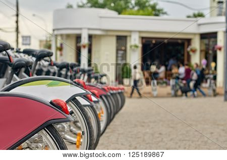 Row of city bikes for rent in Moskow, Russia. focus on the nearest Grips steering
** Note: Shallow depth of field